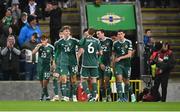 20 November 2023; Isaac Price of Northern Ireland, 14, celebrates with teammates after scoring his side's first goal during the UEFA EURO 2024 Qualifying Round Group H match between Northern Ireland and Denmark at the National Stadium at Windsor Park in Belfast. Photo by Ramsey Cardy/Sportsfile