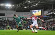 20 November 2023; Victor Kristiansen of Denmark in action against Trai Hume of Northern Ireland during the UEFA EURO 2024 Qualifying Round Group H match between Northern Ireland and Denmark at the National Stadium at Windsor Park in Belfast. Photo by Ramsey Cardy/Sportsfile