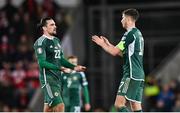 20 November 2023; Ciaron Brown, left, and Paddy McNair of Northern Ireland after the UEFA EURO 2024 Qualifying Round Group H match between Northern Ireland and Denmark at the National Stadium at Windsor Park in Belfast. Photo by Ramsey Cardy/Sportsfile