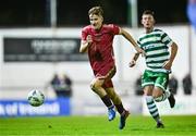 30 October 2023; Gavin Smyth of Galway United and Daniel Burgin of Shamrock Rovers during the EA SPORTS MU19 LOI Enda McGuill Cup match between Galway United and Shamrock Rovers at Eamon Deacy Park in Galway. Photo by Ben McShane/Sportsfile