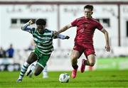 30 October 2023; Gideon Tetteh of Shamrock Rovers and Steven Healy of Galway United during the EA SPORTS MU19 LOI Enda McGuill Cup match between Galway United and Shamrock Rovers at Eamon Deacy Park in Galway. Photo by Ben McShane/Sportsfile