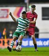 30 October 2023; Daniel Burgin of Shamrock Rovers and Conor Keady of Galway United during the EA SPORTS MU19 LOI Enda McGuill Cup match between Galway United and Shamrock Rovers at Eamon Deacy Park in Galway. Photo by Ben McShane/Sportsfile