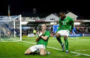 21 November 2023; Killian Phillips of Republic of Ireland, left, celebrates with team-mate Aidomo Emakhu after scoring his side's first goal during the UEFA European Under-21 Championship Qualifier match between Republic of Ireland and Italy at Turners Cross in Cork. Photo by Eóin Noonan/Sportsfile