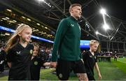 21 November 2023; James McClean of Republic of Ireland walks out with his children, from left, Allie Mae, Willow Ivy and Junior James before the international friendly match between Republic of Ireland and New Zealand at Aviva Stadium in Dublin. Photo by Stephen McCarthy/Sportsfile