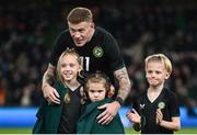 21 November 2023; James McClean of Republic of Ireland with his children, from left, Allie Mae, Willow Ivy and Junior James before the international friendly match between Republic of Ireland and New Zealand at Aviva Stadium in Dublin. Photo by Stephen McCarthy/Sportsfile