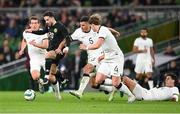 21 November 2023; Mikey Johnston of Republic of Ireland in action against New Zealand players, from left, Joe Bell, Michael Boxall, Nando Pijnaker, and Matt Garbett during the international friendly match between Republic of Ireland and New Zealand at Aviva Stadium in Dublin. Photo by Seb Daly/Sportsfile