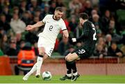 21 November 2023; Tim Payne of New Zealand in action against Mikey Johnston of Republic of Ireland during the international friendly match between Republic of Ireland and New Zealand at the Aviva Stadium in Dublin. Photo by Michael P Ryan/Sportsfile