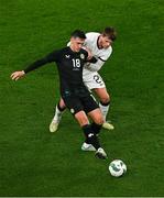 21 November 2023; Jamie McGrath of Republic of Ireland in action against Callum McCowatt of New Zealand during the international friendly match between Republic of Ireland and New Zealand at Aviva Stadium in Dublin. Photo by Ben McShane/Sportsfile