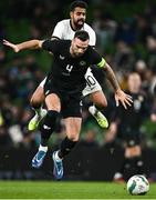 21 November 2023; Shane Duffy of Republic of Ireland in action against Sarpreet Singh of New Zealand during the international friendly match between Republic of Ireland and New Zealand at Aviva Stadium in Dublin. Photo by Piaras Ó Mídheach/Sportsfile