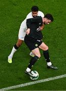 21 November 2023; Mikey Johnston of Republic of Ireland in action against Sarpreet Singh of New Zealand during the international friendly match between Republic of Ireland and New Zealand at Aviva Stadium in Dublin. Photo by Ben McShane/Sportsfile