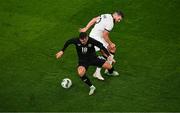 21 November 2023; Jamie McGrath of Republic of Ireland evades the tackle of Tim Payne of New Zealand during the international friendly match between Republic of Ireland and New Zealand at Aviva Stadium in Dublin. Photo by Ben McShane/Sportsfile