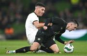 21 November 2023; Jamie McGrath of Republic of Ireland in action against Michael Boxall of New Zealand during the international friendly match between Republic of Ireland and New Zealand at Aviva Stadium in Dublin. Photo by Piaras Ó Mídheach/Sportsfile
