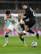 21 November 2023; Mikey Johnston of Republic of Ireland in action against Marko Stamenic of New Zealand during the international friendly match between Republic of Ireland and New Zealand at Aviva Stadium in Dublin. Photo by Seb Daly/Sportsfile