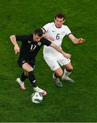 21 November 2023; Jason Knight of Republic of Ireland in action against Joe Bell of New Zealand during the international friendly match between Republic of Ireland and New Zealand at Aviva Stadium in Dublin. Photo by Ben McShane/Sportsfile
