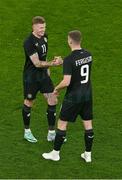 21 November 2023; James McClean of Republic of Ireland, ledt, and team-mate Evan Ferguson during the international friendly match between Republic of Ireland and New Zealand at Aviva Stadium in Dublin. Photo by Ben McShane/Sportsfile