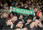21 November 2023; A Republic of Ireland supporter holds up a James McClean scarf during the international friendly match between Republic of Ireland and New Zealand at Aviva Stadium in Dublin. Photo by Seb Daly/Sportsfile