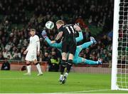 21 November 2023; Republic of Ireland goalkeeper Mark Travers makes a save during the international friendly match between Republic of Ireland and New Zealand at the Aviva Stadium in Dublin. Photo by Michael P Ryan/Sportsfile