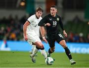 21 November 2023; Jamie McGrath of Republic of Ireland in action against Nando Pijnaker of New Zealand during the international friendly match between Republic of Ireland and New Zealand at the Aviva Stadium in Dublin. Photo by Michael P Ryan/Sportsfile