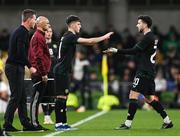 21 November 2023; Andrew Moran of Republic of Ireland, left, comes on as a second half substitute for Mikey Johnston during the international friendly match between Republic of Ireland and New Zealand at Aviva Stadium in Dublin.  Photo by Stephen McCarthy/Sportsfile