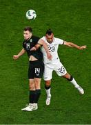 21 November 2023; Jayson Molumby of Republic of Ireland in action against Clayton Lewis of New Zealand during the international friendly match between Republic of Ireland and New Zealand at Aviva Stadium in Dublin. Photo by Ben McShane/Sportsfile