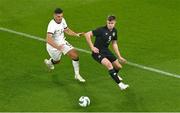 21 November 2023; Evan Ferguson of Republic of Ireland in action against Michael Boxall of New Zealand during the international friendly match between Republic of Ireland and New Zealand at Aviva Stadium in Dublin. Photo by Ben McShane/Sportsfile
