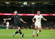 21 November 2023; Ryan Manning of Republic of Ireland in action against Max Mata of New Zealand during the international friendly match between Republic of Ireland and New Zealand at the Aviva Stadium in Dublin. Photo by Michael P Ryan/Sportsfile