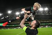 21 November 2023; Shane Duffy of Republic of Ireland with Junior James McClean, son of James McClean, after the international friendly match between Republic of Ireland and New Zealand at Aviva Stadium in Dublin. Photo by Stephen McCarthy/Sportsfile