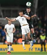 21 November 2023; Elijah Just of New Zealand in action against Josh Cullen of Republic of Ireland during the international friendly match between Republic of Ireland and New Zealand at Aviva Stadium in Dublin. Photo by Stephen McCarthy/Sportsfile