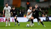 21 November 2023; Jamie McGrath of Republic of Ireland in action against Marko Stamenic of New Zealand during the international friendly match between Republic of Ireland and New Zealand at the Aviva Stadium in Dublin. Photo by Seb Daly/Sportsfile