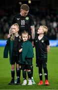 21 November 2023; James McClean of Republic of Ireland with his children, from left, Allie Mae, Willow Ivy and Junior James before the international friendly match between Republic of Ireland and New Zealand at Aviva Stadium in Dublin. Photo by Stephen McCarthy/Sportsfile