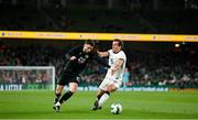 21 November 2023; Mikey Johnston of Republic of Ireland in action against Joe Bell of New Zealand during the international friendly match between Republic of Ireland and New Zealand at the Aviva Stadium in Dublin. Photo by Seb Daly/Sportsfile