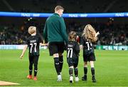 21 November 2023; James McClean of Republic of Ireland with his children, from left, Junior James, Willow Ivy and Allie Mae before the international friendly match between Republic of Ireland and New Zealand at Aviva Stadium in Dublin. Photo by Stephen McCarthy/Sportsfile