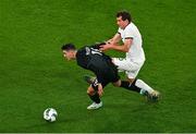 21 November 2023; Jamie McGrath of Republic of Ireland and Joe Bell of New Zealand during the international friendly match between Republic of Ireland and New Zealand at Aviva Stadium in Dublin. Photo by Ben McShane/Sportsfile