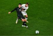 21 November 2023; Jamie McGrath of Republic of Ireland and Callum McCowatt of New Zealand during the international friendly match between Republic of Ireland and New Zealand at Aviva Stadium in Dublin. Photo by Ben McShane/Sportsfile