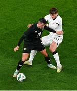 21 November 2023; Jamie McGrath of Republic of Ireland and Callum McCowatt of New Zealand during the international friendly match between Republic of Ireland and New Zealand at Aviva Stadium in Dublin. Photo by Ben McShane/Sportsfile