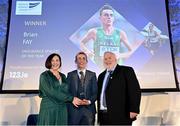 22 November 2023; Endurance Athlete of the Year Brian Fay is presented with his award by  RSA Insurance Managing Director Elaine Robinson and Athletics Ireland President John Cronin during the 123.ie National Athletics Awards at Crowne Plaza Hotel in Santry, Dublin. A full list of winners from the event can be found at AthleticsIreland.ie Photo by Sam Barnes/Sportsfile