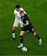 21 November 2023; James McClean of Republic of Ireland and Matt Garbett of New Zealand during the international friendly match between Republic of Ireland and New Zealand at Aviva Stadium in Dublin. Photo by Ben McShane/Sportsfile