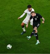 21 November 2023; James McClean of Republic of Ireland and Matt Garbett of New Zealand during the international friendly match between Republic of Ireland and New Zealand at Aviva Stadium in Dublin. Photo by Ben McShane/Sportsfile