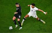 21 November 2023; Jamie McGrath of Republic of Ireland and Marko Stamenic of New Zealand during the international friendly match between Republic of Ireland and New Zealand at Aviva Stadium in Dublin. Photo by Ben McShane/Sportsfile