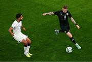 21 November 2023; James McClean of Republic of Ireland and Sarpreet Singh of New Zealand during the international friendly match between Republic of Ireland and New Zealand at Aviva Stadium in Dublin. Photo by Ben McShane/Sportsfile