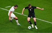 21 November 2023; Evan Ferguson of Republic of Ireland gets past Nando Pijnaker of New Zealand during the international friendly match between Republic of Ireland and New Zealand at Aviva Stadium in Dublin. Photo by Ben McShane/Sportsfile