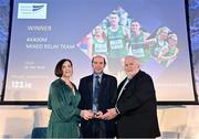 22 November 2023; Coach Drew Harrison is presented with the Team of the Year Award on behalf of the Budapest 4x400m mixed relay team, by RSA Insurance Managing Director Elaine Robinson and Athletics Ireland President John Cronin during the 123.ie National Athletics Awards at Crowne Plaza Hotel in Santry, Dublin. A full list of winners from the event can be found at AthleticsIreland.ie Photo by Sam Barnes/Sportsfile