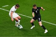 21 November 2023; Evan Ferguson of Republic of Ireland gets past Nando Pijnaker of New Zealand during the international friendly match between Republic of Ireland and New Zealand at Aviva Stadium in Dublin. Photo by Ben McShane/Sportsfile