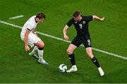 21 November 2023; Evan Ferguson of Republic of Ireland gets past Nando Pijnaker of New Zealand during the international friendly match between Republic of Ireland and New Zealand at Aviva Stadium in Dublin. Photo by Ben McShane/Sportsfile