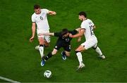 21 November 2023; Andrew Moran of Republic of Ireland in action against Joe Bell, left, and Libby Cacace of New Zealand during the international friendly match between Republic of Ireland and New Zealand at Aviva Stadium in Dublin. Photo by Ben McShane/Sportsfile