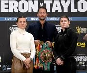 23 November 2023; Chantelle Cameron and Katie Taylor square-off, in the company of promoter Eddie Hearn, during a press conference at the Dublin Royal Convention Centre ahead of their super lightweight championship fight, on November 25th at 3Arena in Dublin. Photo by Stephen McCarthy/Sportsfile