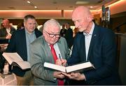 24 November 2023; Former Kilkenny hurling manager Brian Cody, right, signs autographs during the launch of Allianz Cumann na mBunscol 50th anniversary book, &quot;50 Bliain ag Fás’, at Croke Park in Dublin. Photo by Sam Barnes/Sportsfile