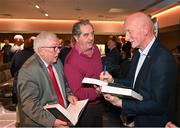 24 November 2023; Former Kilkenny hurling manager Brian Cody signs autographs during the launch of Allianz Cumann na mBunscol 50th anniversary book, &quot;50 Bliain ag Fás’, at Croke Park in Dublin. Photo by Sam Barnes/Sportsfile