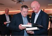 24 November 2023; Former Kilkenny hurling manager Brian Cody, right, signs autographs during the launch of Allianz Cumann na mBunscol 50th anniversary book at Croke Park in Dublin. Photo by Sam Barnes/Sportsfile
