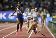 19 August 2023; Alexis Holmes of USA, left, on her way to winning the mixed 4x400m relay as Femke Bol of Netherlands falls during day one of the World Athletics Championships at the National Athletics Centre in Budapest, Hungary. Photo by Sam Barnes/Sportsfile Photo by Sam Barnes/Sportsfile